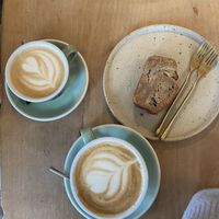 Oat cappuccino, large soy cappuccino, vegan banana breadd  at Back to Black - Weteringstraat in Amsterdam