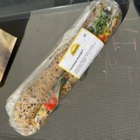 Sandwich houmous avocat en pain gris.  at Panos in Mons