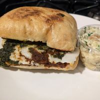 Chicken Parmesan sandwich with potato salad at Rebel Cheese in Austin