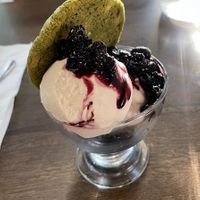 Coconut ice cream, berry compote, matcha and white chocolate cookie  at Vegivores in Reading