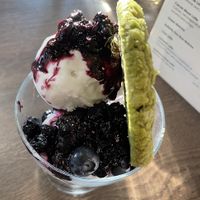 Coconut ice cream, berry compote, matcha and white chocolate cookie  at Vegivores in Reading