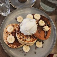 three pancakes with banana, cocoa nibs, and ice cream (i asked later to add chocolate sauce too and they did) at Vegivores in Reading