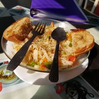 vegan herb rice noodle pasta with garlic, herbs, olive oil and bread at Aum Cafe in Varanasi