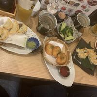 Pan and deep fried veggie gyoza, cheese potatoes and cucumbers with sesame oil/ seeds  at Gyozaoh Dotonbori in Osaka