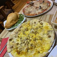 Carbonara pizza, deep fried calzone  at Sora Lella Roman Vegan Restaurant in Edinburgh