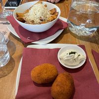 Supplì (rice balls) and Chips Cacio & Pepe  at Sora Lella Roman Vegan Restaurant in Edinburgh