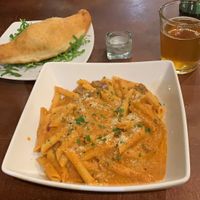Penne alla Vodka and a calzone on the side  at Sora Lella Roman Vegan Restaurant in Edinburgh