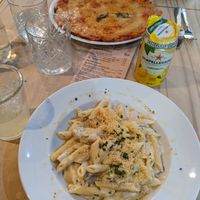 Quattro formaggi pasta and Margherita pizza in the back at Sora Lella Roman Vegan Restaurant in Edinburgh