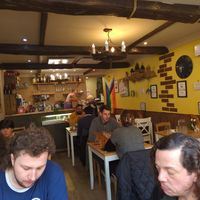 The warm, inviting interior of the restaurant at Sora Lella Roman Vegan Restaurant in Edinburgh