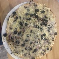 Quattro formaggi con funghi with red onions and black olives   at Sora Lella Roman Vegan Restaurant in Edinburgh