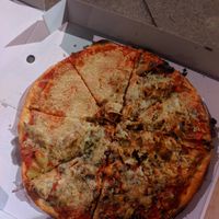 Half of the pizza missing toppings. Extremely greasy and oily throughout at Sora Lella Roman Vegan Restaurant in Edinburgh