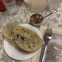 Amuse-bouche consisting of a toasted baguette with nut-seed-mix and a mustard based vegetable dip  at Marchfelderhof in Deutsch-wagram