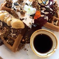 buckwheat waffles with nutella, raspberries, coconut yoghurt, crunchy buckinis and banana at Barefoot Eatery in Christchurch