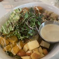 Great bowl: Spring greens, Quinoa, tahini sweet potatoes, avocado, apple, oranges, cashew dressing, fruit and nut mix! at Nice Sprout in Houston