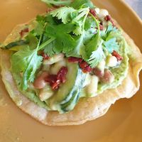 Corn tostada with mixed bean and jalapeño salad in miso dressing. at Curious Yellow Kafe in North London