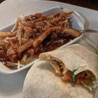 Vegan chicken buffalo guacamole wrap with a side poutine! at The Feathery Pub in St Catharines