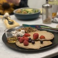 Vegan and gluten free pancakes with berries, house-made granola, Agave and coconut whip cream at my bowl in Osaka
