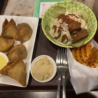 Samosas, falafel snack, and mesh fries, with side of hummus  at Falafel Brothers - Shibuya in Tokyo