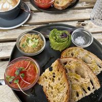 Toast with tomato, and added avocado and baba hanous  at Blackbird in Valencia