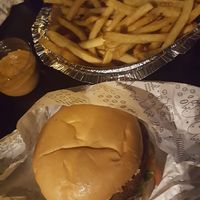 Potato bread, falafel burger, hummus, fried sliced aubergine, pickles, red onion, lettuce and tomato + frites  at Sim Sala Bim - Bom Fim in Porto Alegre