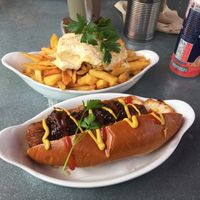 Vegan hotdog and hummus topped homemade chips with tahini   at Alpine Coffee Shop and Gallery in Betws-y-coed
