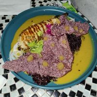 Aubergine with black rice under chips with mango gel at Violeta in Santiago