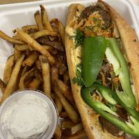 Blazing banh mi sandwich with fries  at Plum Bistro in Seattle