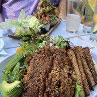Salad COVERED in vegan meat - not great   at Plum Bistro in Seattle