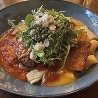 Perfectly thin Crispy eggplant parm on a bed of creamy Alfredo pasta and when that marinara and Alfredo blends it’s divine ! #Veganuary at Plum Bistro in Seattle