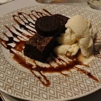 Warm chocolate brownie with dairy free ice cream. We tried to have a vegan oreo sundae but they didn't have enough oreos so they added their last oreo as an extra at Shoreline in Paignton