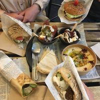 Pita falafel, wrap falafel, burger falafel. Halloumi, falafel fries et houmous. Le tout pour 41€.   at Maha in Brussels