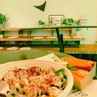 Plants, bleachers, halloumi at Maha in Brussels