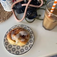 Warm vegan cinnamon bun and iced coffee   at Calma Cafe in Gran Canaria