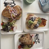 Vegan Pancakes with fruit and agave, Vegan Avocado & Veggie Triassant served with salad mix and veggies and a peppers & guacamole grilled sandwich with vegan cheese  at Calma Cafe in Gran Canaria