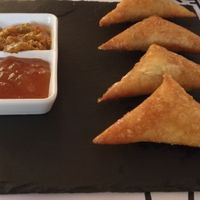 Vegetable samosas with mango chutney and lime pickle  at Ganesh Cocina Ecléctica in Xativa