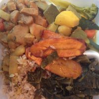 curry veggies and un-goat, plantains, rice and collard greens at Healthful Essence in Atlanta