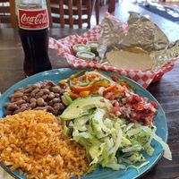 Fajitas plate with pinto beans, salsa verde, corn tortillas and a mexican Coke.  at La Cumbre Taqueria in San Francisco