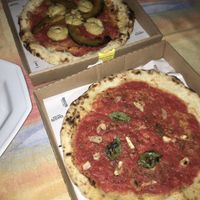 Pumpkin and cream cheese pizza and marinara sauce pizza at Squisito Pizzeria in Porto Alegre