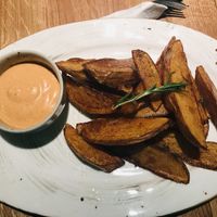 Fries accompanied by a delish sauce  at Mission in Moscow