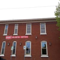 Large parking lot on left side of building.  at Ruby Coffee Roasters in Stevens Point
