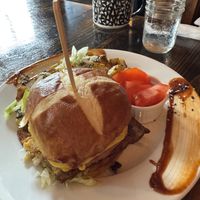 Burger with tomatoes on the sidee  at Revelstoke in Peterborough