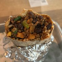 Whole wheat tortilla, white rice, black beans, chili sin carne, sweet potato, corn, tasty tomato sauce 13,45€  at Chidoz in Haarlem