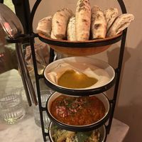 Mezze, salad, sourdough pita  at HUMM Restaurant in Antwerpen