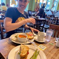 Avocado panini with side of asparagus. Tofu scrabble with tomato soup. Delicious ! Hip fun progressive space   at Busboys and Poets - Langston Lofts in Washington