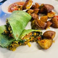 Tofu veggie wrap with home fries  at Busboys and Poets - Langston Lofts in Washington