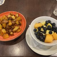 Breakfast (Side Potatoes and Fruit Bowl) 😜  at Busboys and Poets - Mount Vernon Triangle in Washington