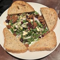 Greek salad (minus cheeae) with tempeh bacon and toastted #Veganuary at Busboys and Poets - Mount Vernon Triangle in Washington