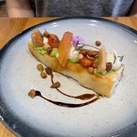 Focaccia with crème fraiche and savoury pickled peach   at the friendly kitchen in Paris