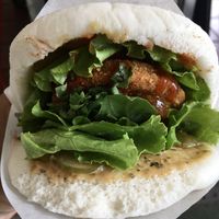 Signature flavour gua bao with a chicken patty, vegetables and burger sauce  at Xiǎo Lái Gua Bāo 小來刈包 in Tainan