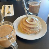 Coconut chai with a cinnamon roll to share   at Blossoming Lotus - Irvington in Portland